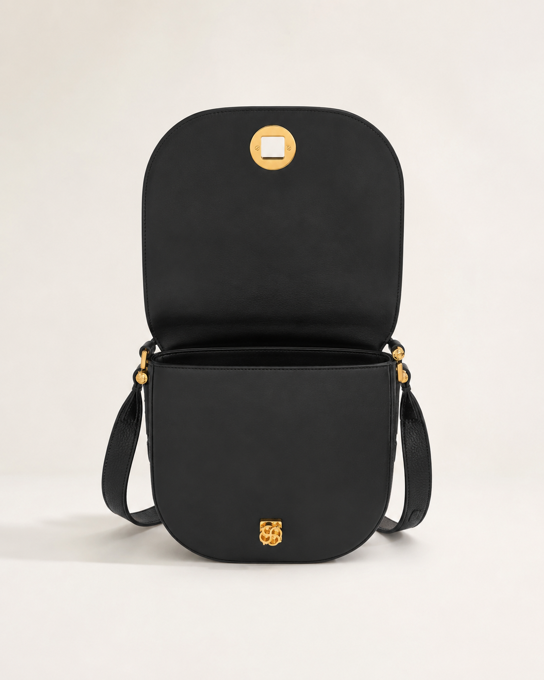 Sac saddle noir en cuir et suède avec quincaillerie dorée, vue de face